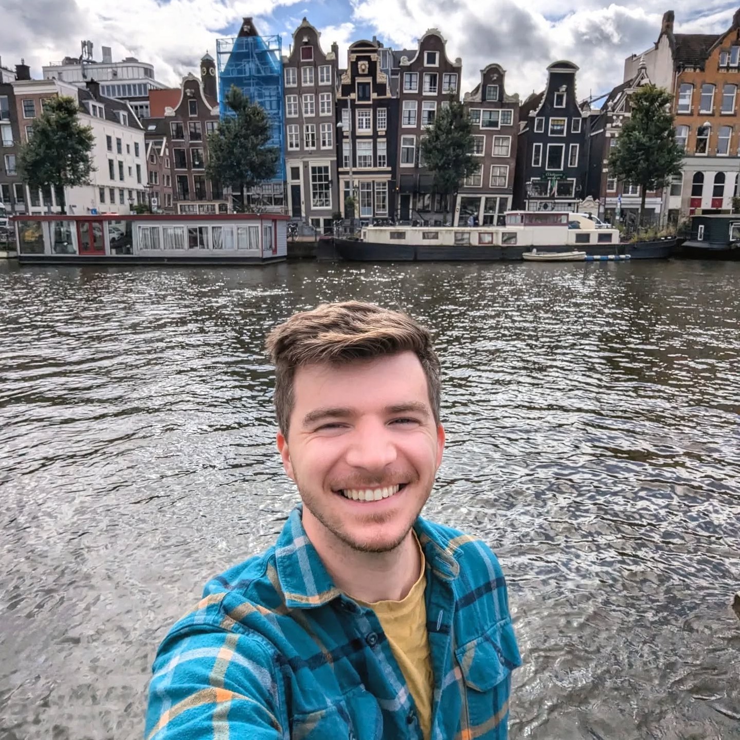 Amsterdam 🇳🇱
                                From left to right: the Dancing Houses, canal tour under a bridge, the Montelbaanstoren, another canal, selfie over the water, bikes lined up along bridges, and a colorful pedestrian street.